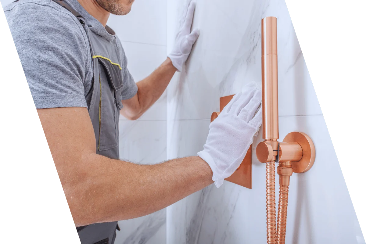 remodeler finishing bathroom wall