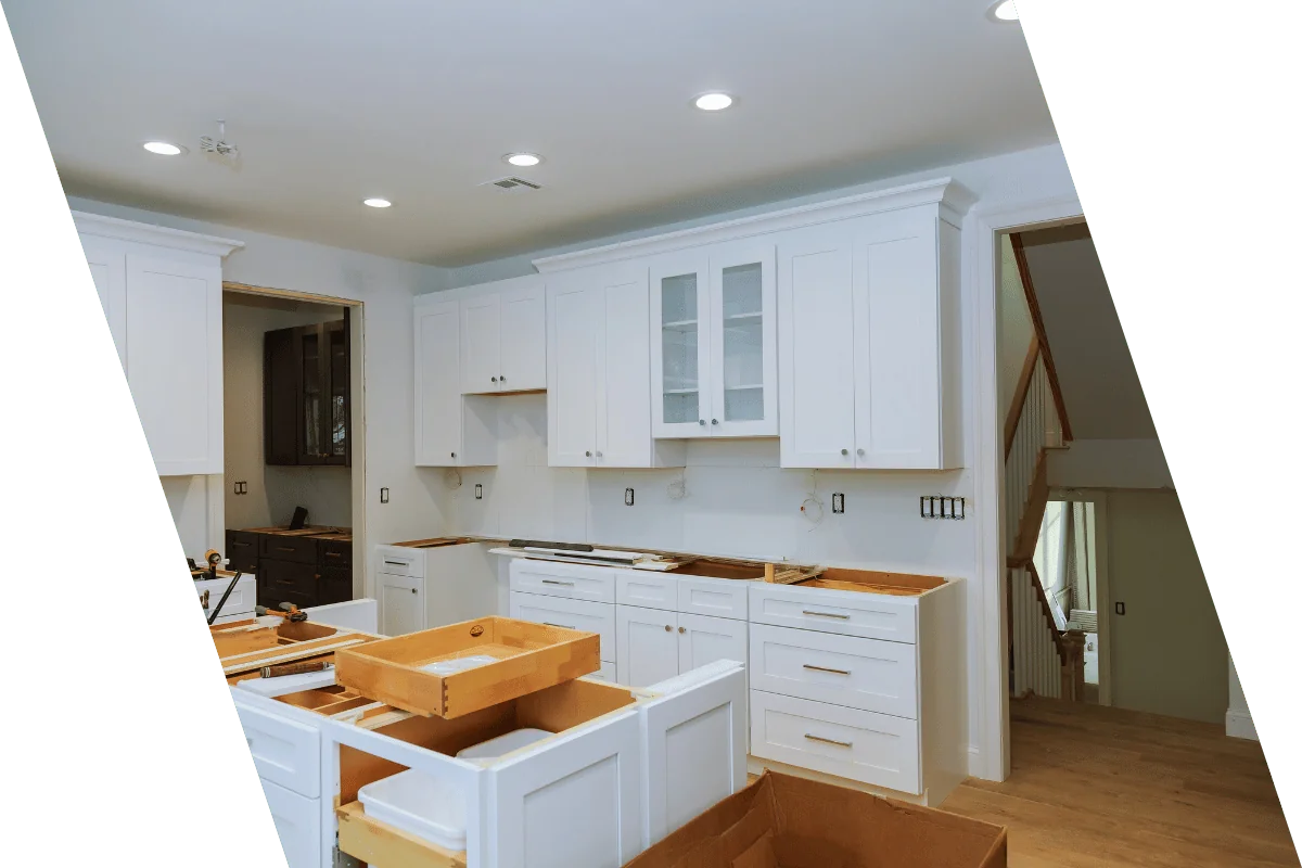 a kitchen with modern appliances and sleek countertops being installed by contractors in Metrowest MA.