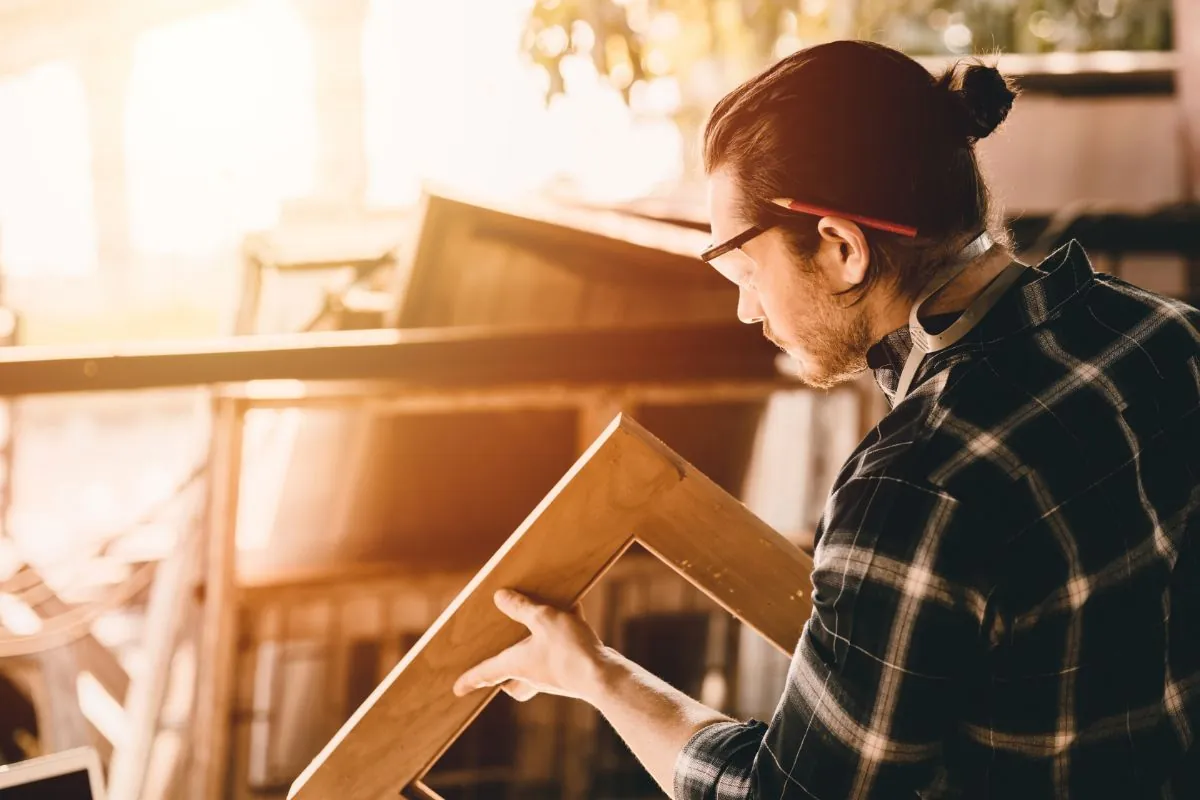 the carpenters man high experienced wood worker making furniture